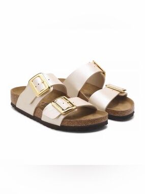 Birkenstock Pearl White Two-Strap Sandals with Gold Buckles